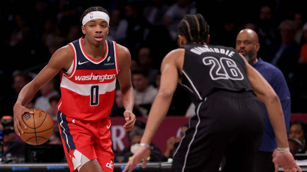 Dec 8, 2023; Brooklyn, New York, USA; Washington Wizards guard Bilal Coulibaly (0) controls the ball against Brooklyn Nets guard Spencer Dinwiddie (26) during the fourth quarter at Barclays Center.